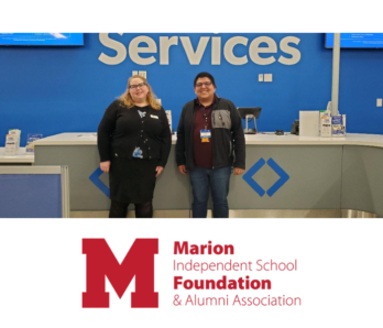 Marion Foundation Director posing with manager from Sam's Club.